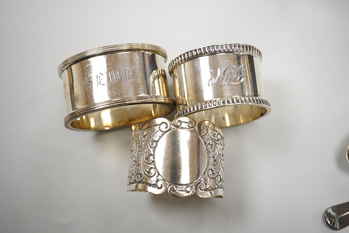 Three assorted 20th century silver napkin rings, a George V silver mustard pot and pepperette, a set of six late Victorian silver coffee spoons, London, 1883, and six other silver items.